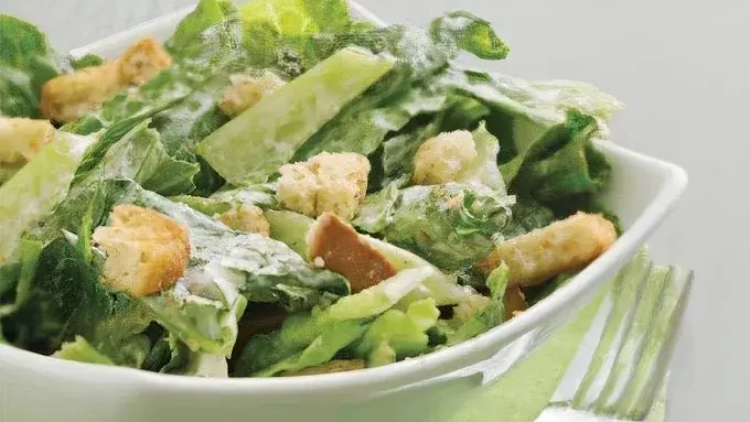 A crisp Caesar salad with romaine, croutons and creamy dressing served at Fit For Life Cafe